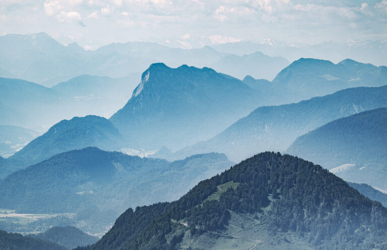View from the Hochries in Bavaria, with the silhouettes of other Alpine peaks