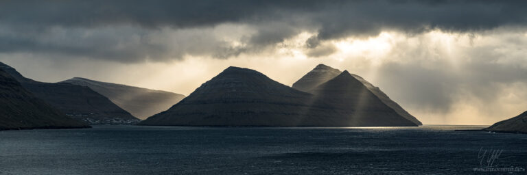 Epic light mood over Bordoy on the Faroe Islands as panorama