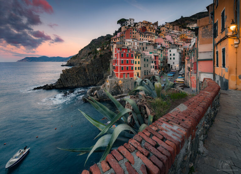 Idyllic village of Riomaggiore in the Cinque Terre at sunrise in Italy