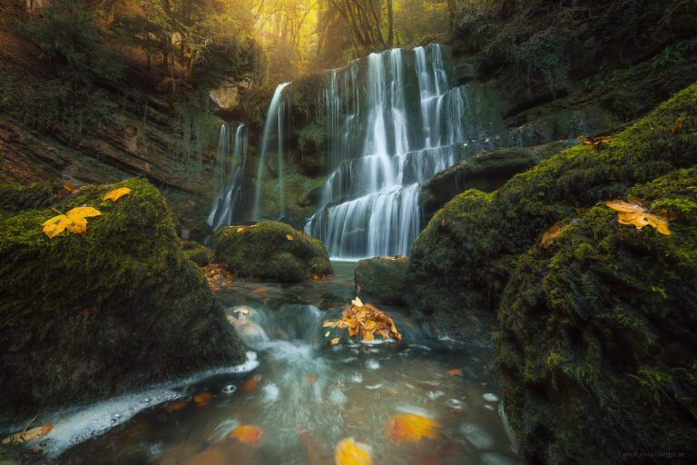 Golden October day at the Cascade du Verneau waterfall in the French Jura
