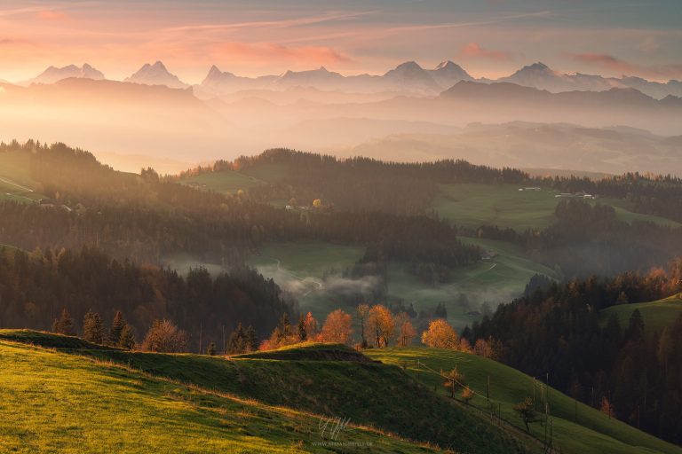Wide view in the Swiss Emmental with a view of the great Alpine peaks Eiger, Mönch and Jungfrau in the early autumn morning light