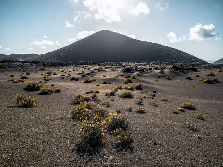 View over the black lava desert on Lanzarote at Timanfaya National Park in late daylight