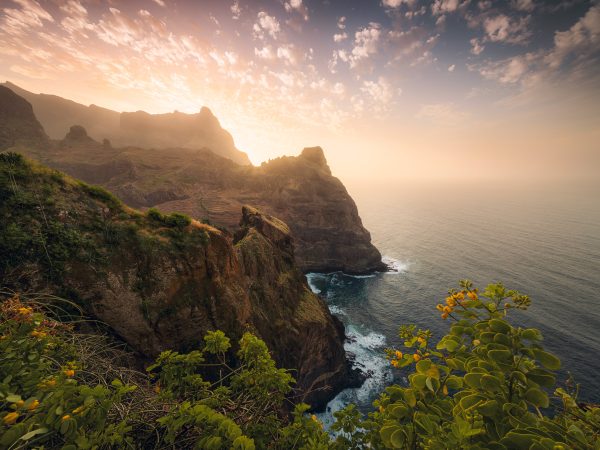 On the rugged cliffs of the north coast of Santo Antao - Cape Verde - Africa, to the colourful sunset
