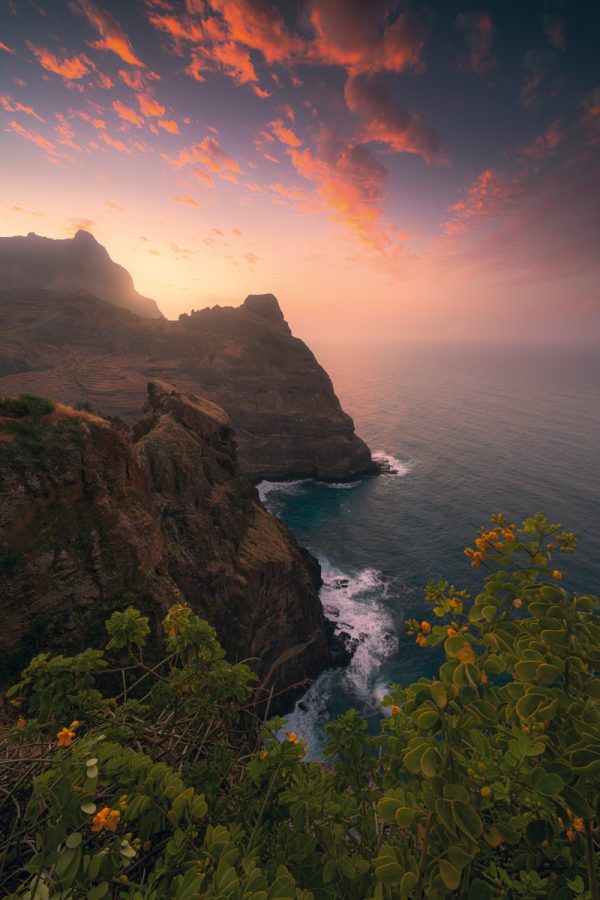 Portrait on the rugged cliffs of the north coast of Santo Antao - Cape Verde - Africa, to the colourful sunset.