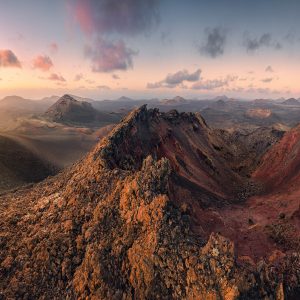 View into the volcanic maw of Montana del Senalo with Pico Partido in the background in the volcanic terrain of Lanzarote - NP Timanfayo - at sunset.