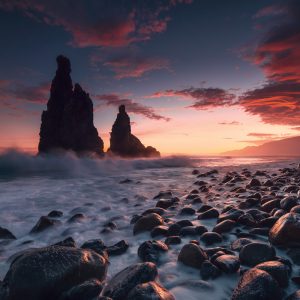 Seastack on the Atlantic island of Madeira in the colourful sunrise with splashing waves