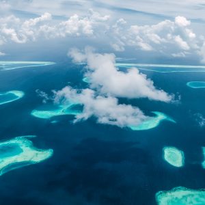 A bird's eye view of parts of South Male Atoll. Like turquoise tears in the dark blue sea.