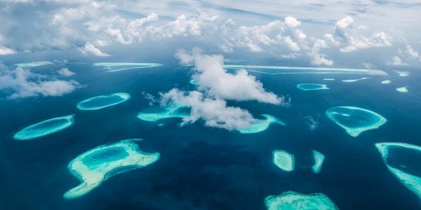 A bird's eye view of parts of South Male Atoll. Like turquoise tears in the dark blue sea.