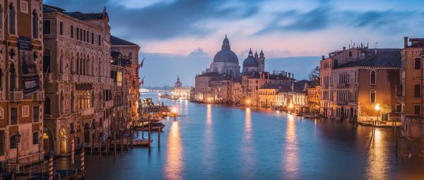 View over the Grand Canal to the Basilica Santa Maria della Salute in the colourful dawn